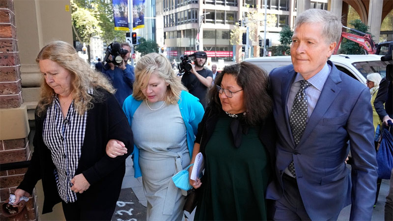 Steve Johnson, right, with his sisters, Terry, left, and Rebecca and his wife Rosemarie, second right, arrive at the Supreme Court in Sydney, May 2, 2022